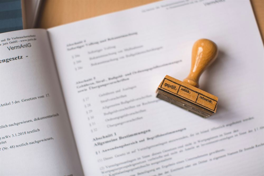 Legal documents and certification stamp for minpaku permits